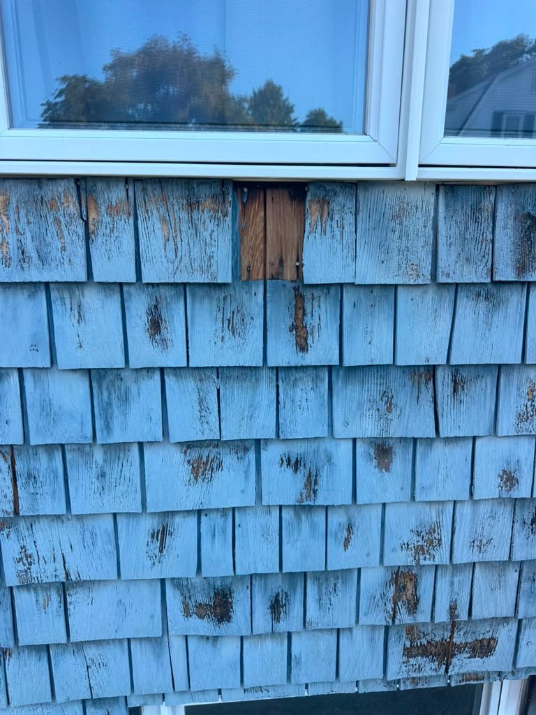 Weathered exterior shingles before painting