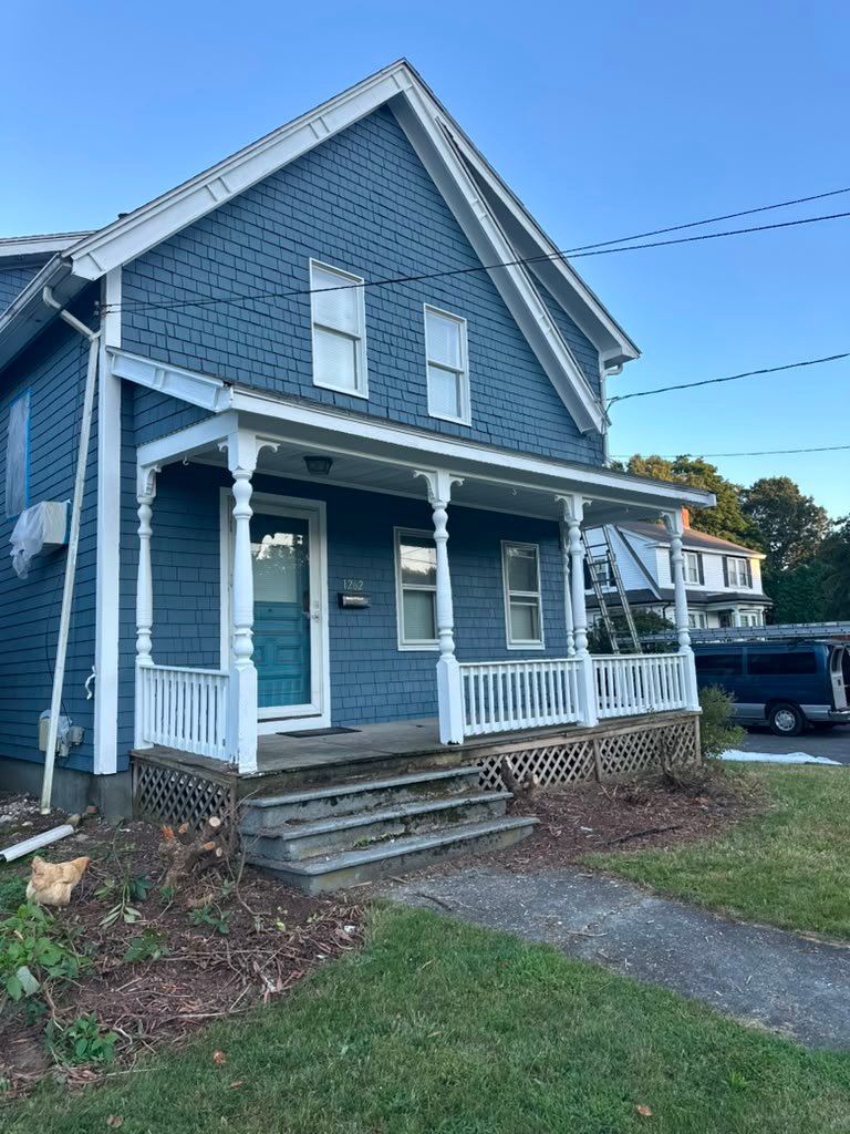 Blue house porch after exterior painting
